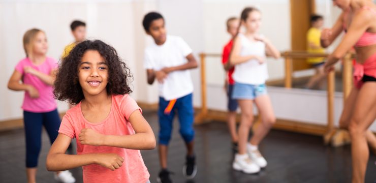 Portrait,Of,Cheerful,Little,African,American,Girl,Training,Movements,During